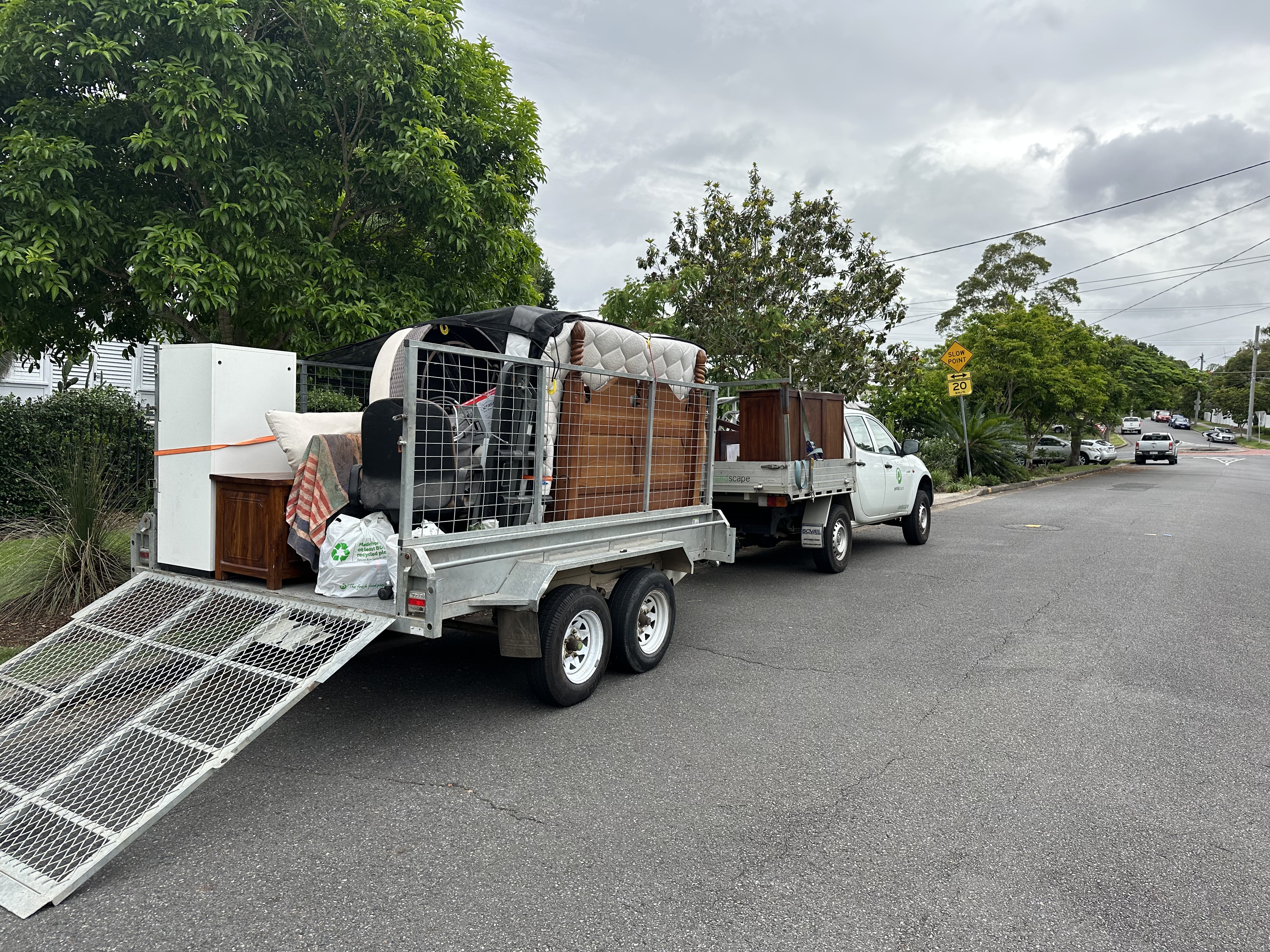 Bin Chicken Co ute and trailer loaded for residential junk removal on Gold Coast