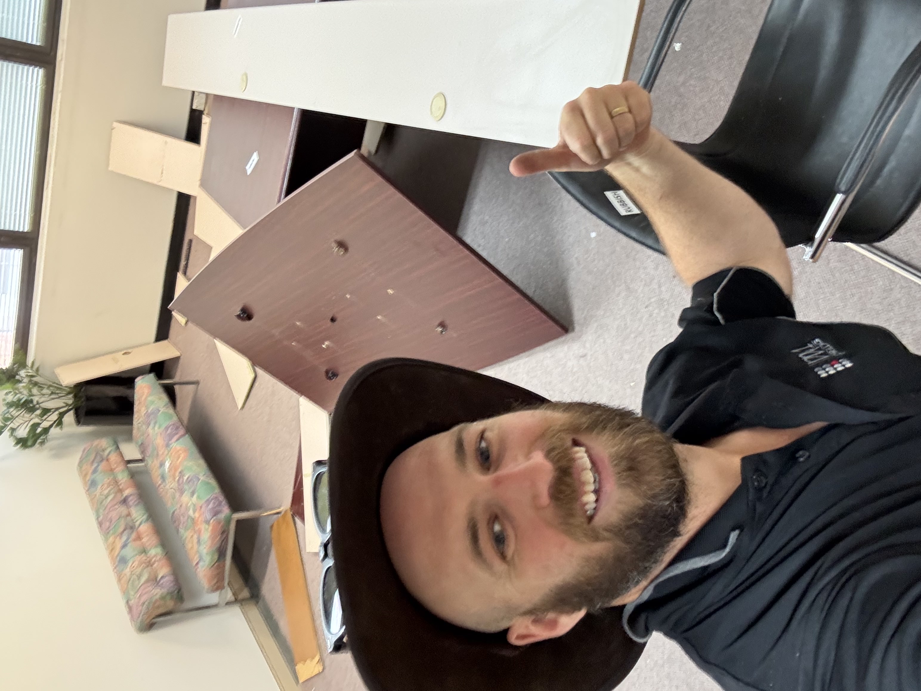 Josh from Bin Chicken Co giving thumbs up during office clearout